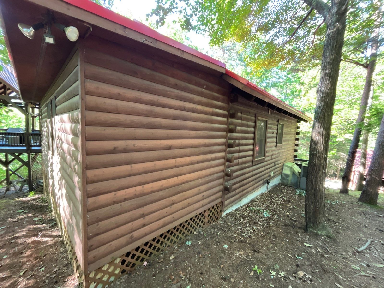 Faded log side wall of a Cherry Log, GA cabin before staining