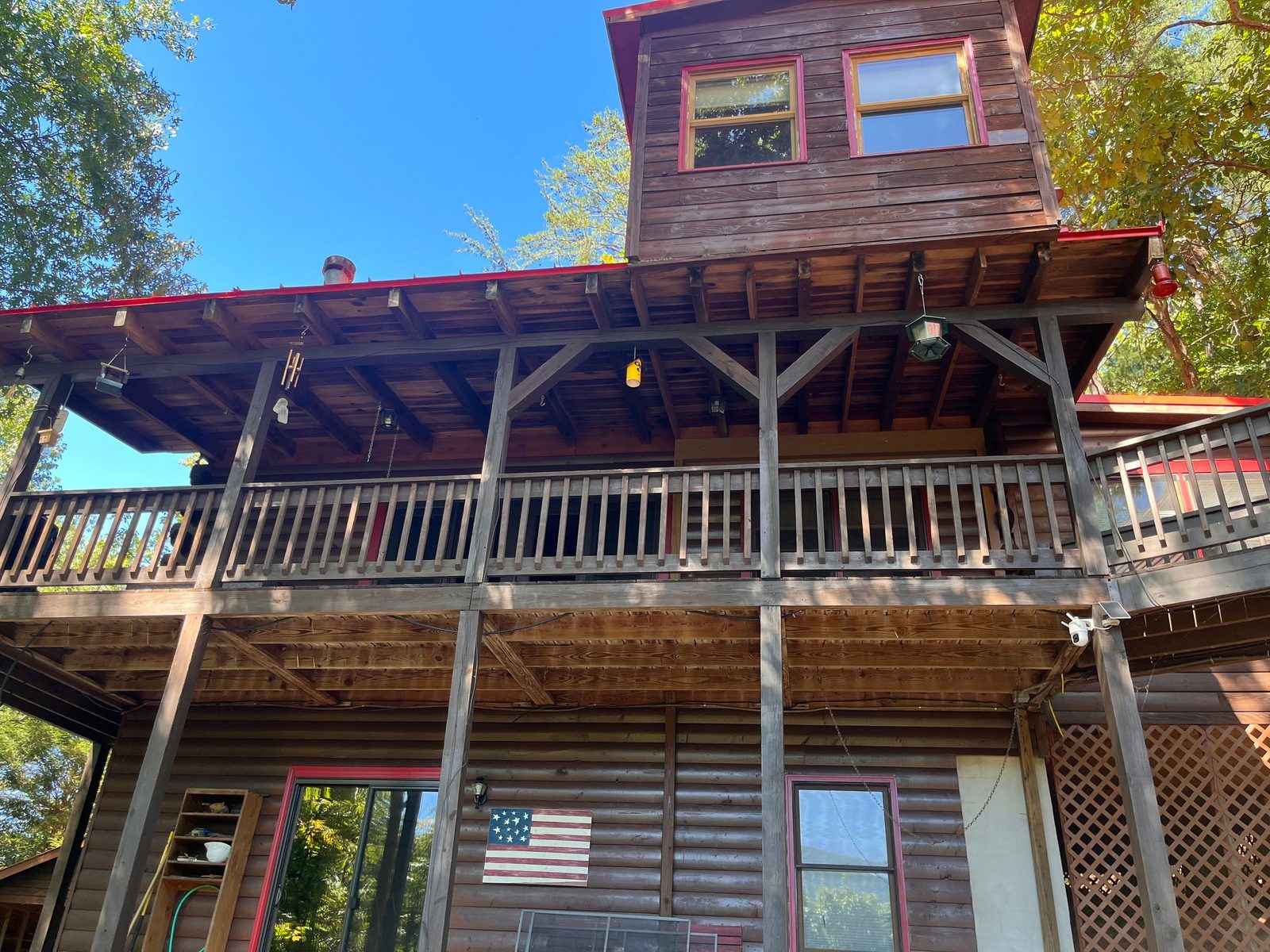Covered deck and stained log walls on a Cherry Log, GA cabin after staining